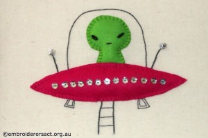 Alien in spacecraft stitched by Jillian Bath