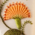 Orange needlewoven flower