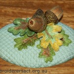 Detail of stumpwork acorns stitched by Yvonne Kingsley