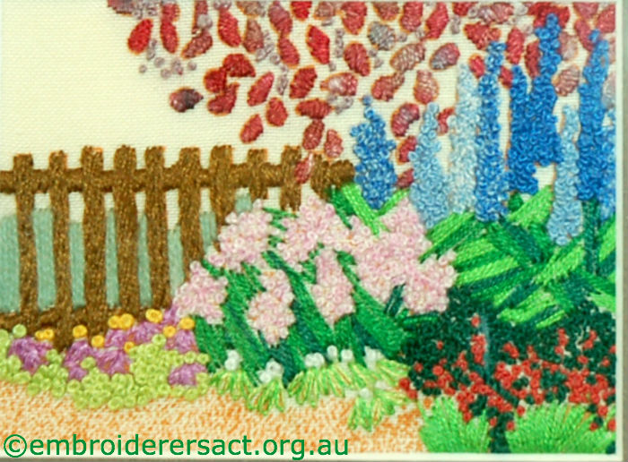 Garden fence embroidery stitched by Kathy Pascoe