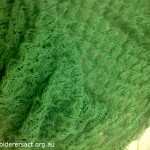 Green knitted shawl