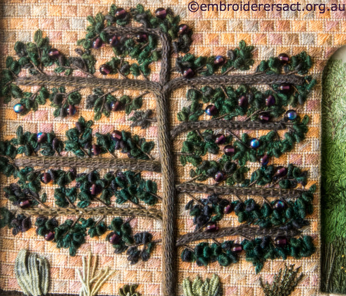Stitchery of espaliered plum tree
