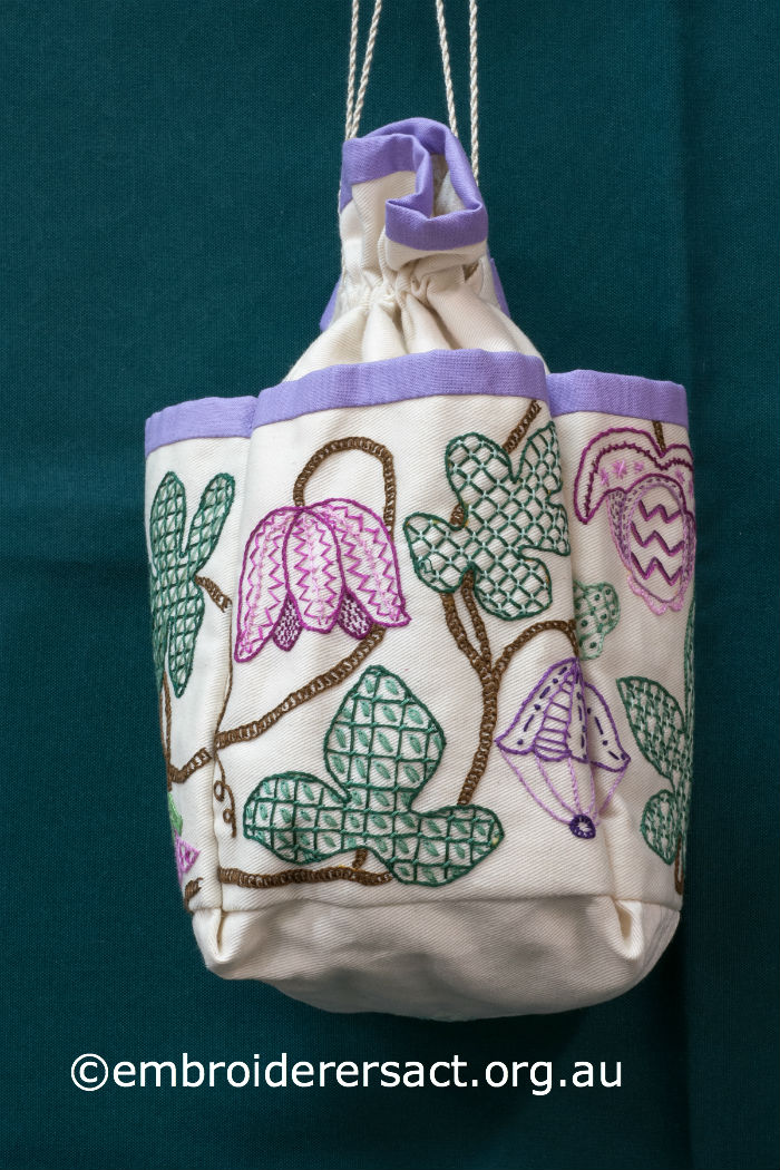 Detail Jacobean Embroidery on bag held in Guild